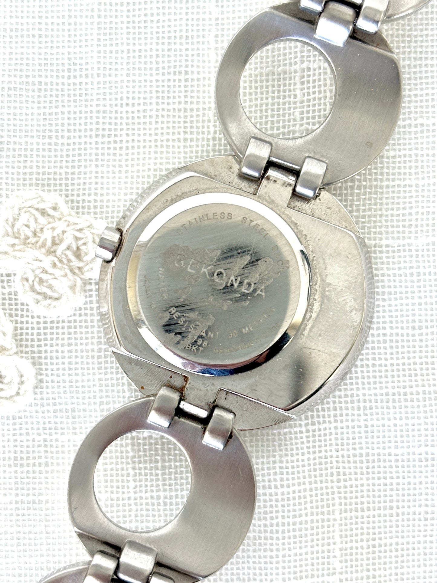 Seksy/Seconda Shell Face Rhinestone Accent Circular Asymmetrical Band Watch