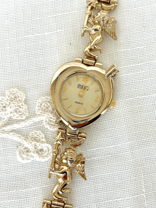 Studio C Heart-Shaped Bezel Cupid Motif Band Gold Tone Quartz Watch
