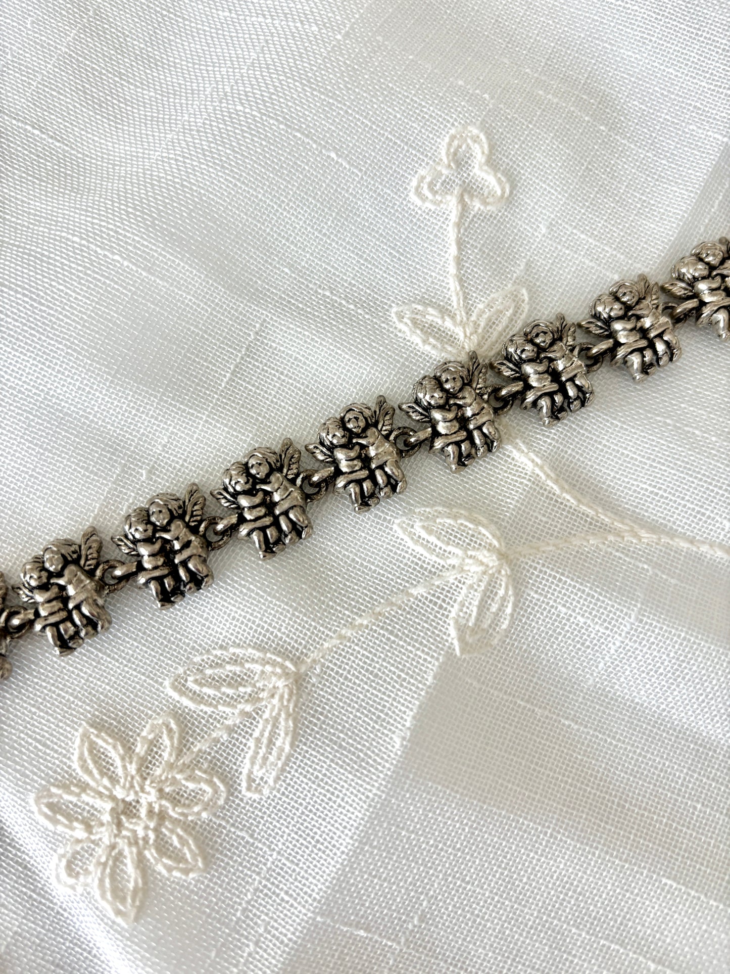 Hugging Angels Silver Tone Bracelet
