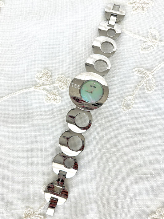 Seksy/Seconda Shell Face Rhinestone Accent Circular Asymmetrical Band Watch