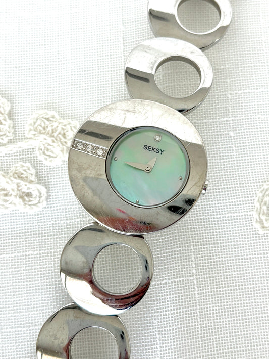 Seksy/Seconda Shell Face Rhinestone Accent Circular Asymmetrical Band Watch